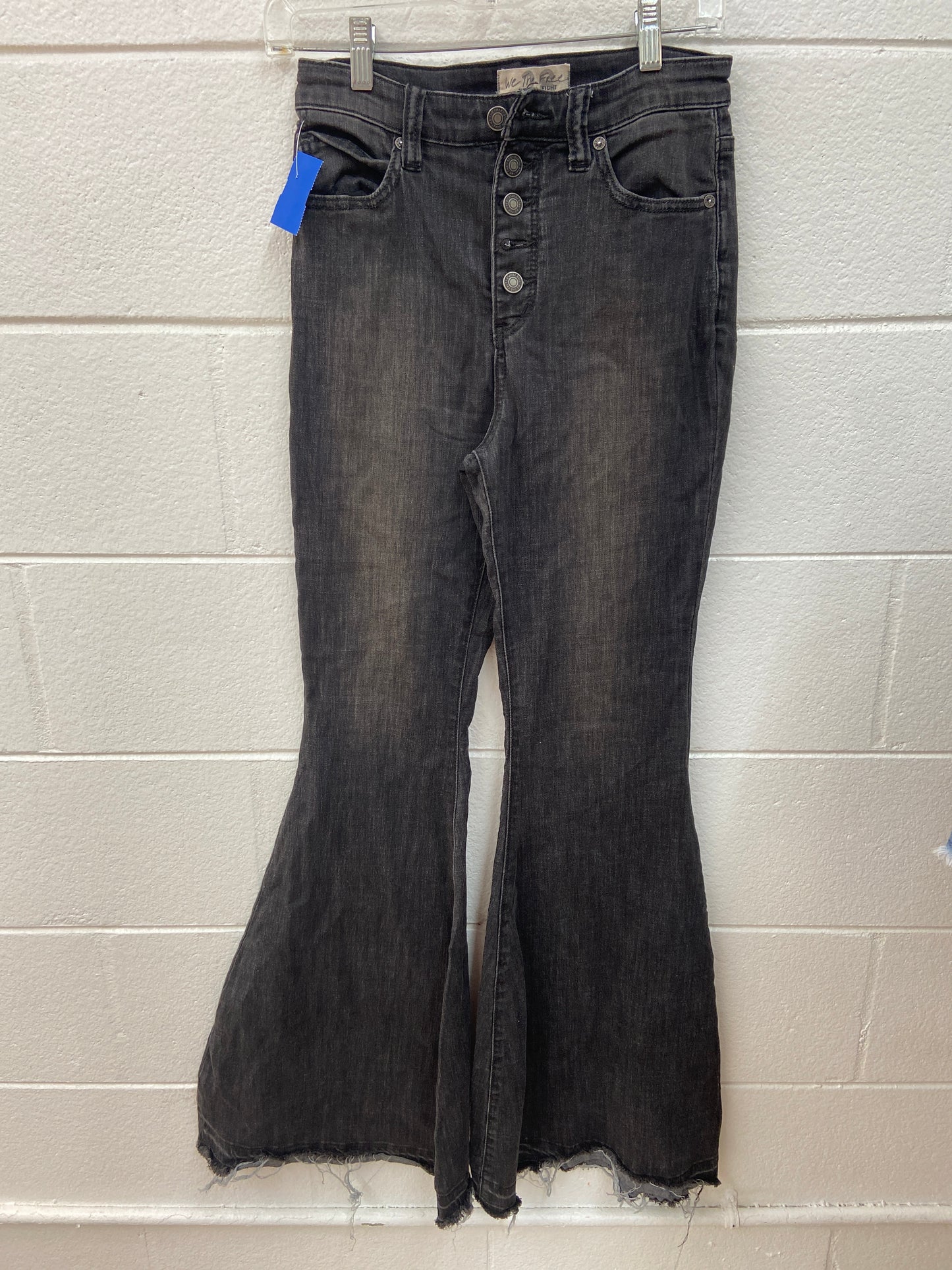 WE THE FREE BELL BOTTOMS 28 JEANS